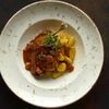 Утиная ножка конфи с ньокками и соусом из белых грибов в MeatBarrique по цене 1200